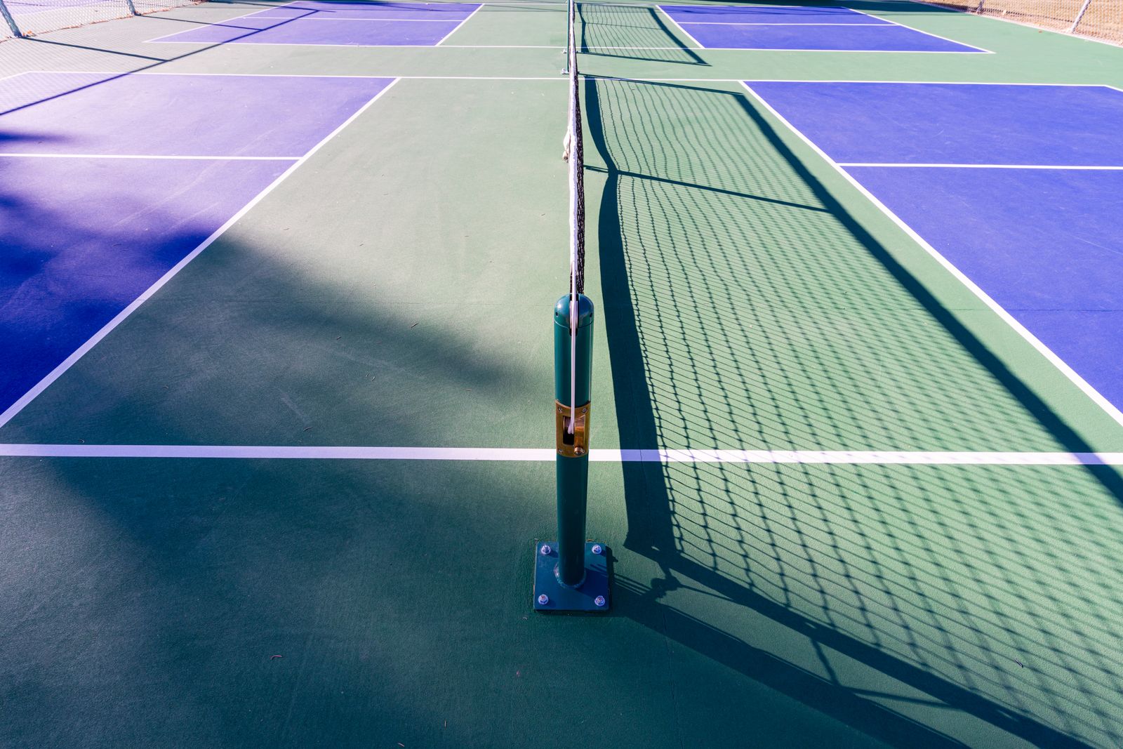 A clean pickleball court surface with crisp painted lines